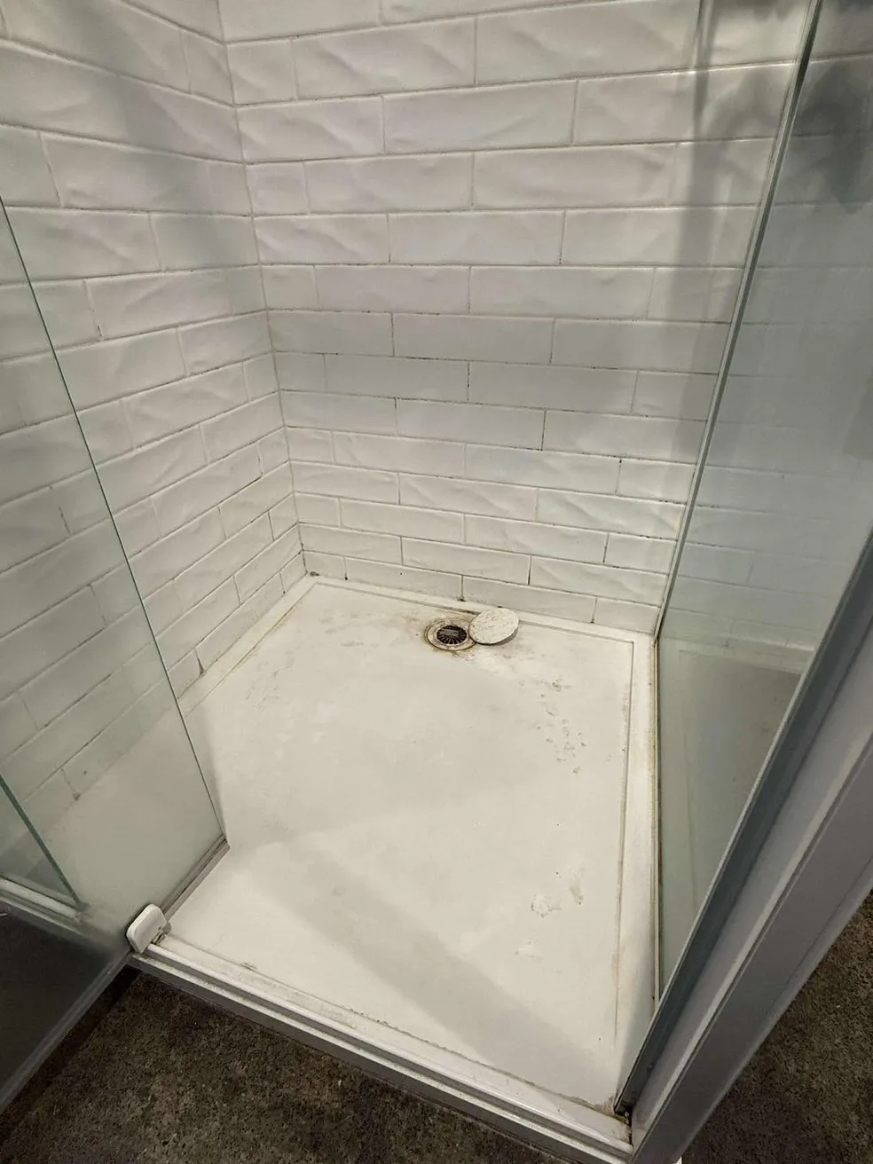Shower floor before cleaning